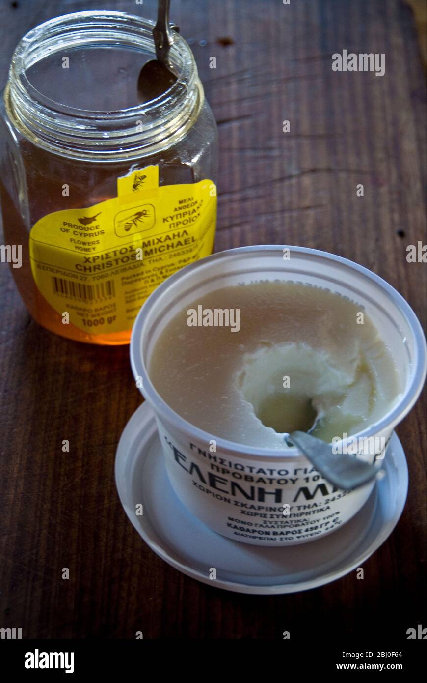 Plastic carton of Greek set cow's milk yoghurt with Cypriot honey, on