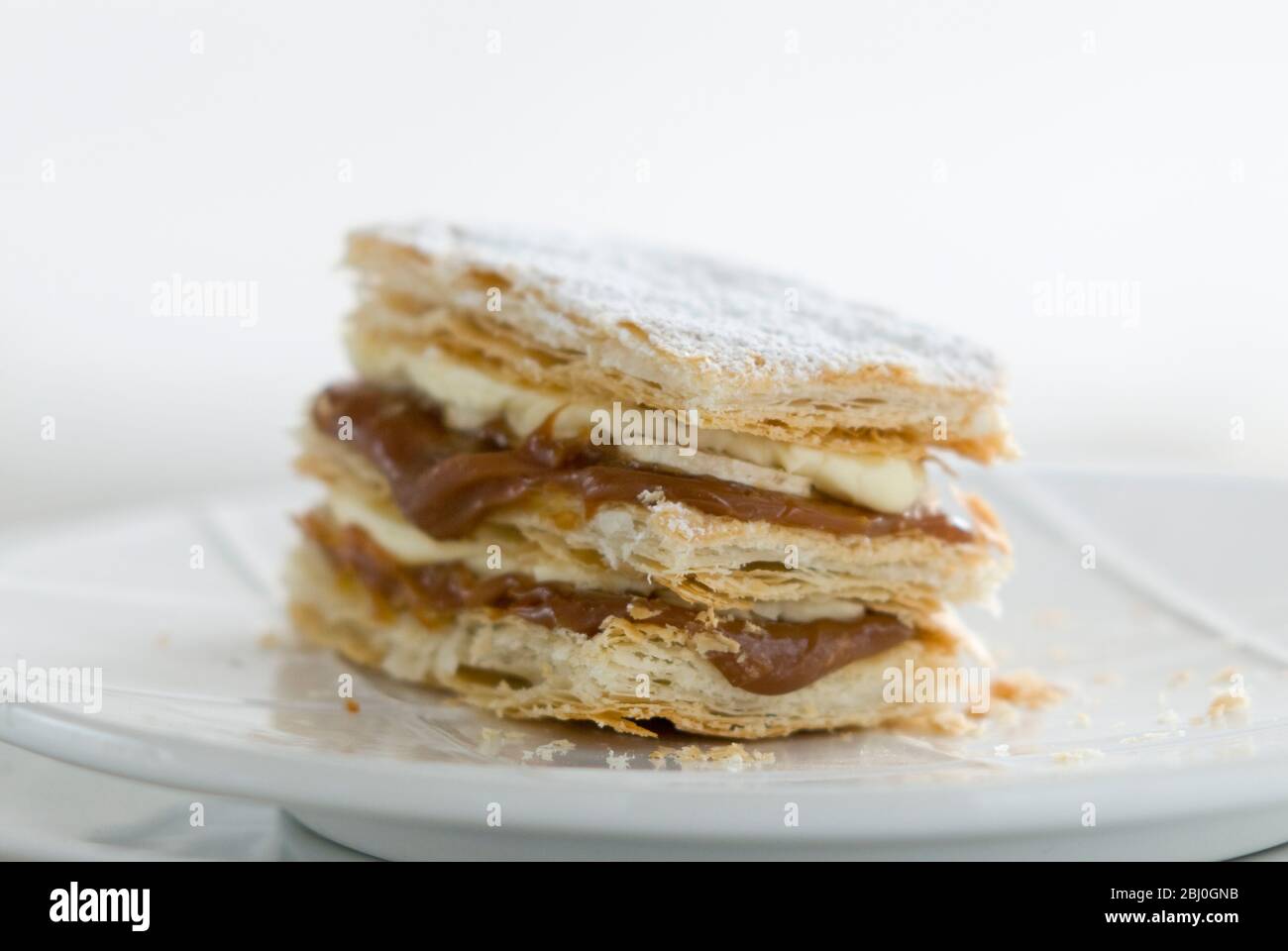 Layered mille feuilles pastry with whipped cream and dulce de leche. - Stock Photo