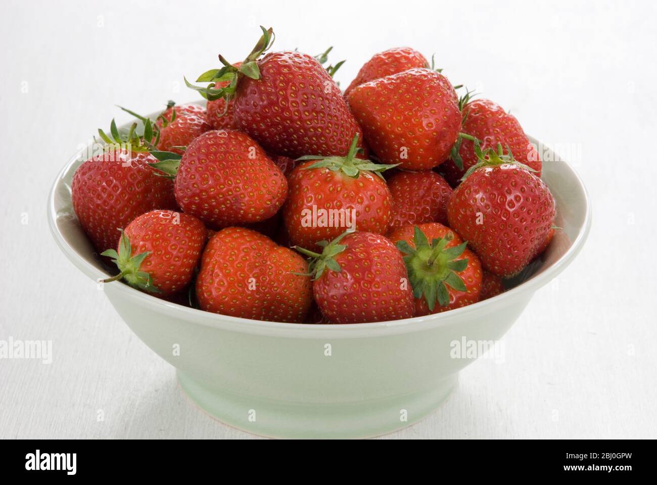 Bowl full of ripe red strawberries. Stock Photo
