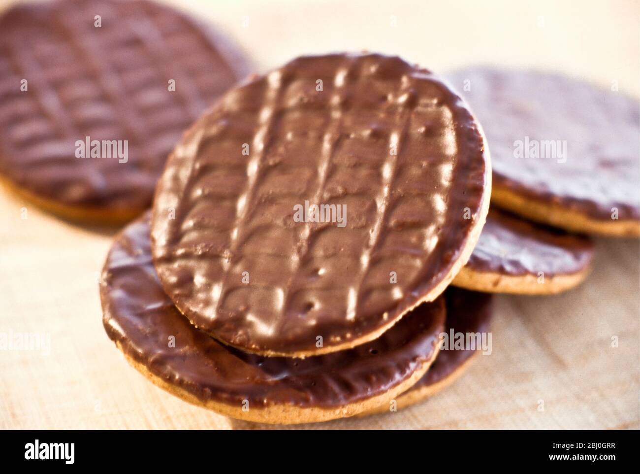 Pile of chocolate digestive biscuits - Stock Photo