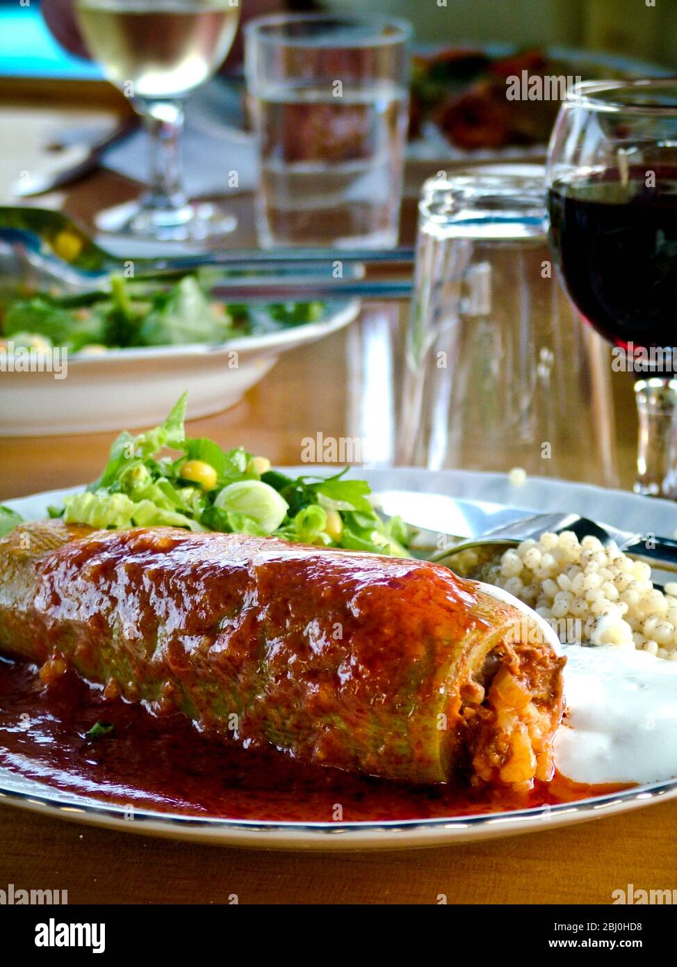 Stuffed zucchini with salad and rice onboard gulet off southen Turkish coast - Stock Photo