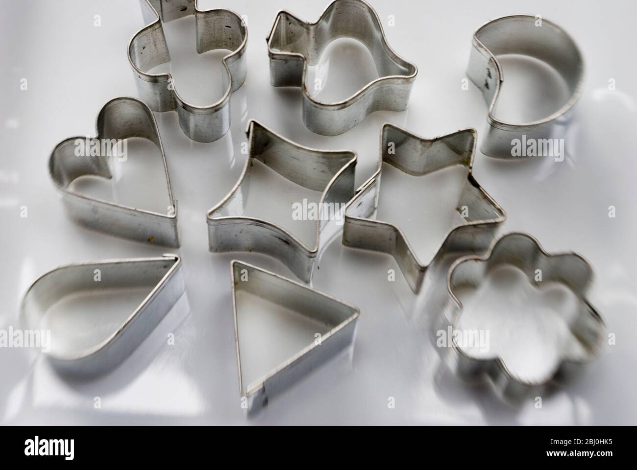 Collection of tin cutters for cutting aspic and hors d'ouevres - Stock Photo