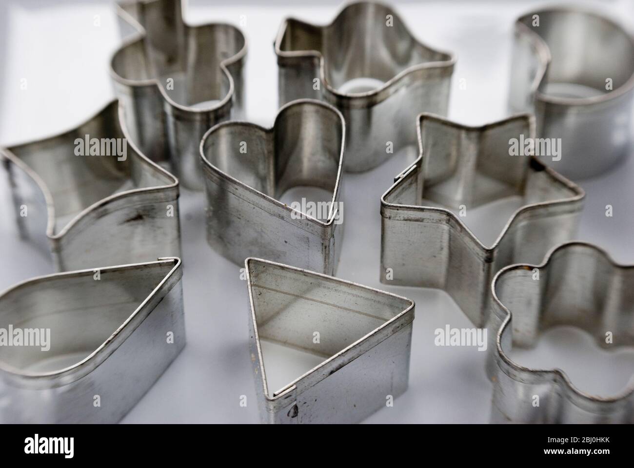 Collection of tin cutters for cutting aspic and hors d'ouevres - Stock Photo
