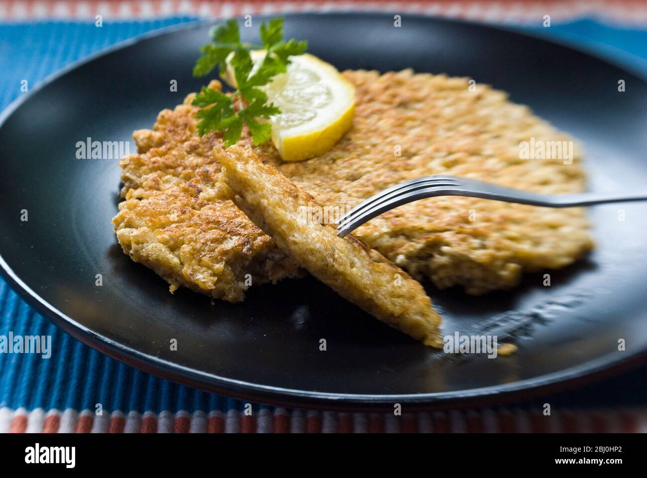 Pancake made with 1 decilitre of rolled oats mixed with a beaten egg and a little salt, then cooked in a frying pan with a little butter - - Stock Photo