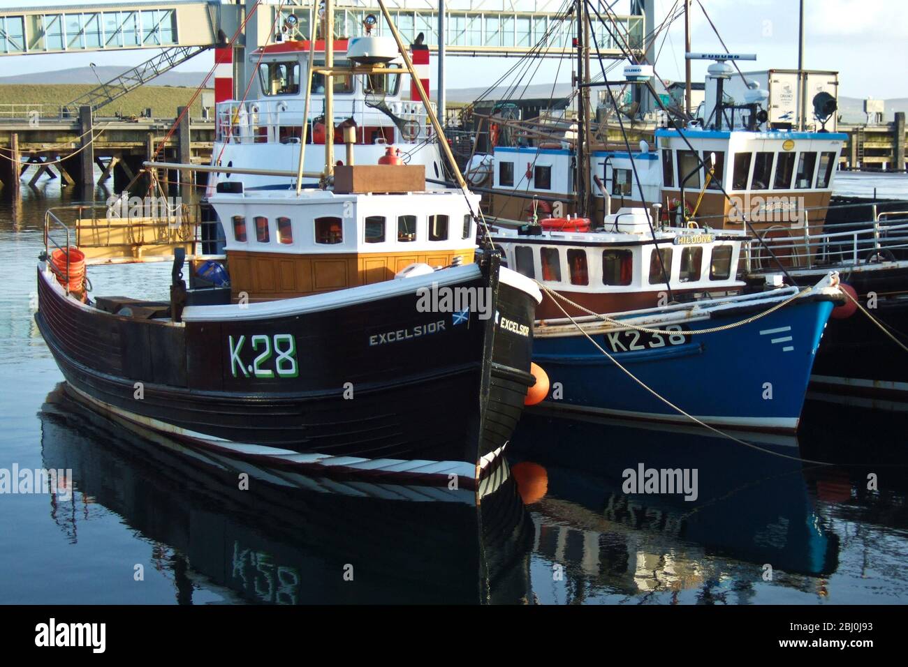 Fishing boats in harbour, Stromness, Orkney, UK - Stock Photo
