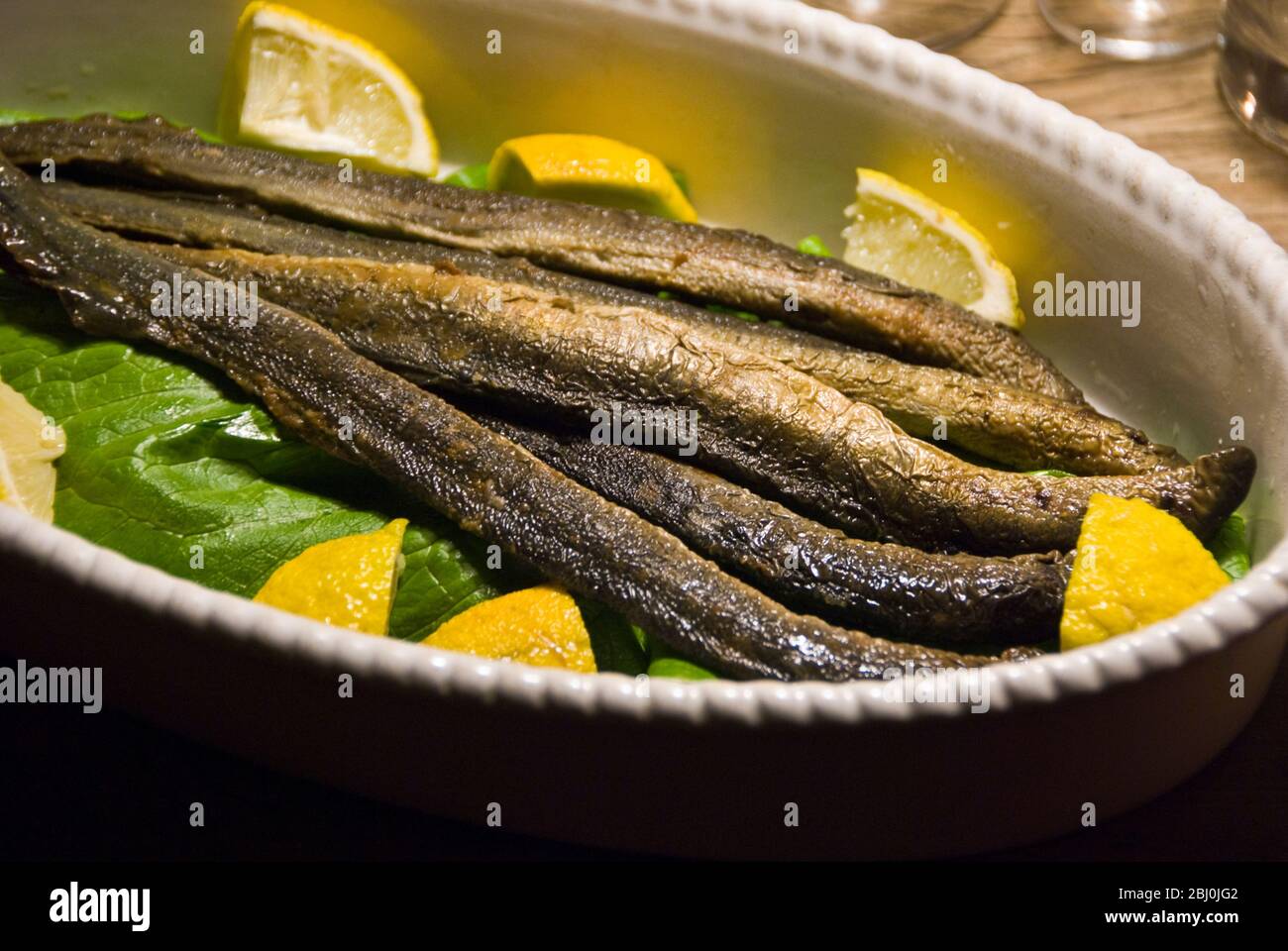 Lampreys from Finland served as a starter - Stock Photo