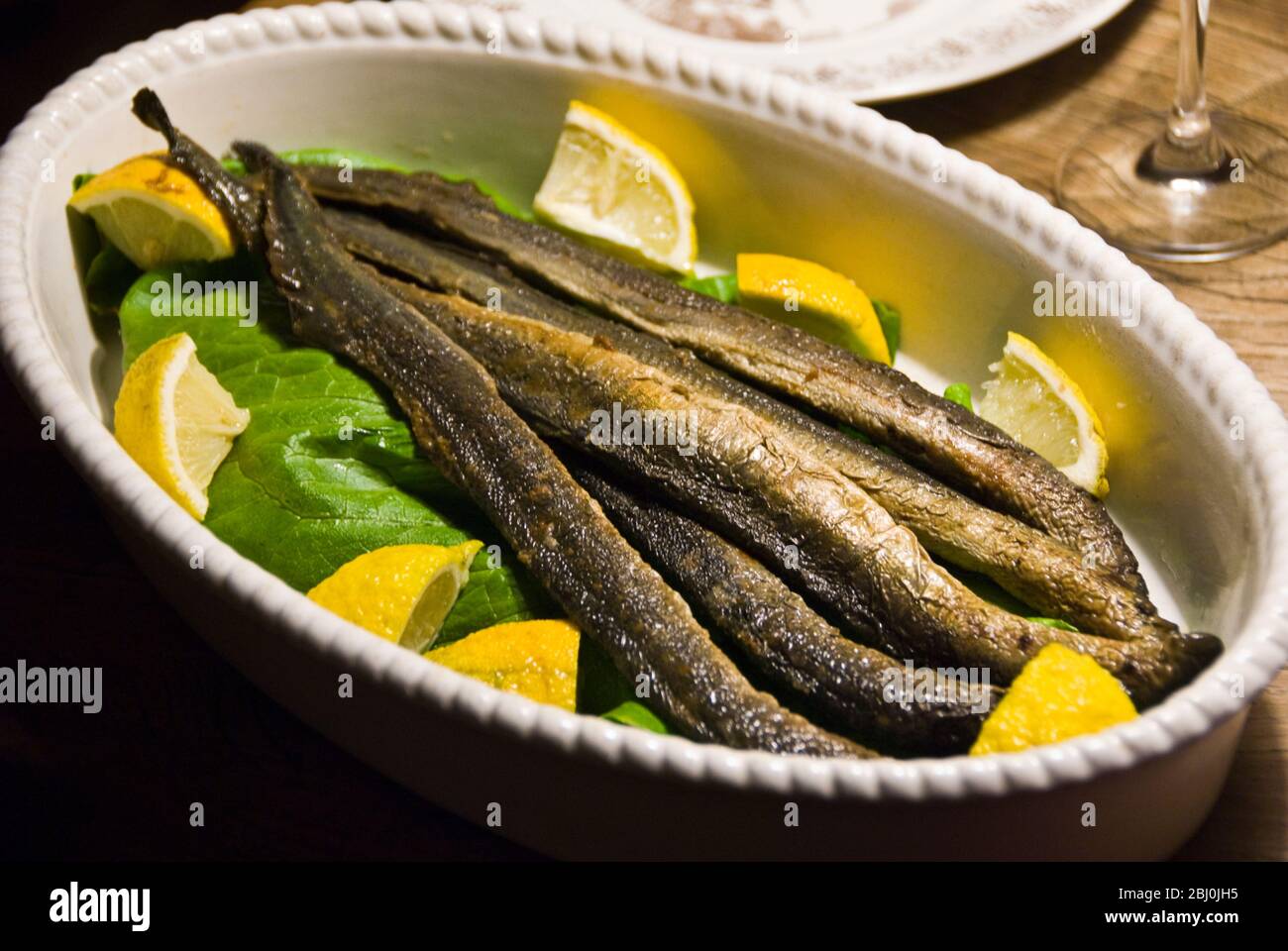 Lampreys from Finland served as a starter - Stock Photo