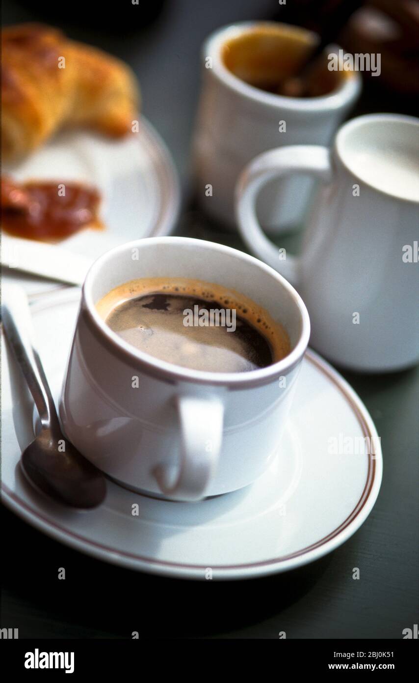 Cups of coffee and chocolate on table in French cafŽ. - Stock Photo