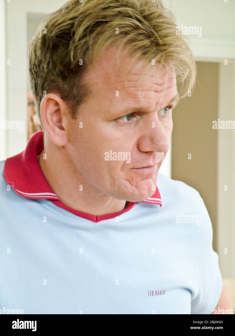 Chef Gordon Ramsay cooking in his kitchen - Stock Photo