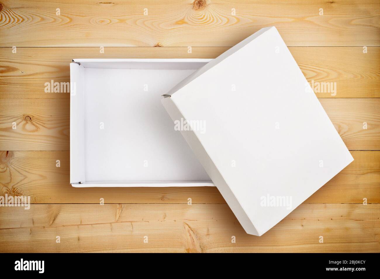 Opened empty cardboard box with cover Stock Photo