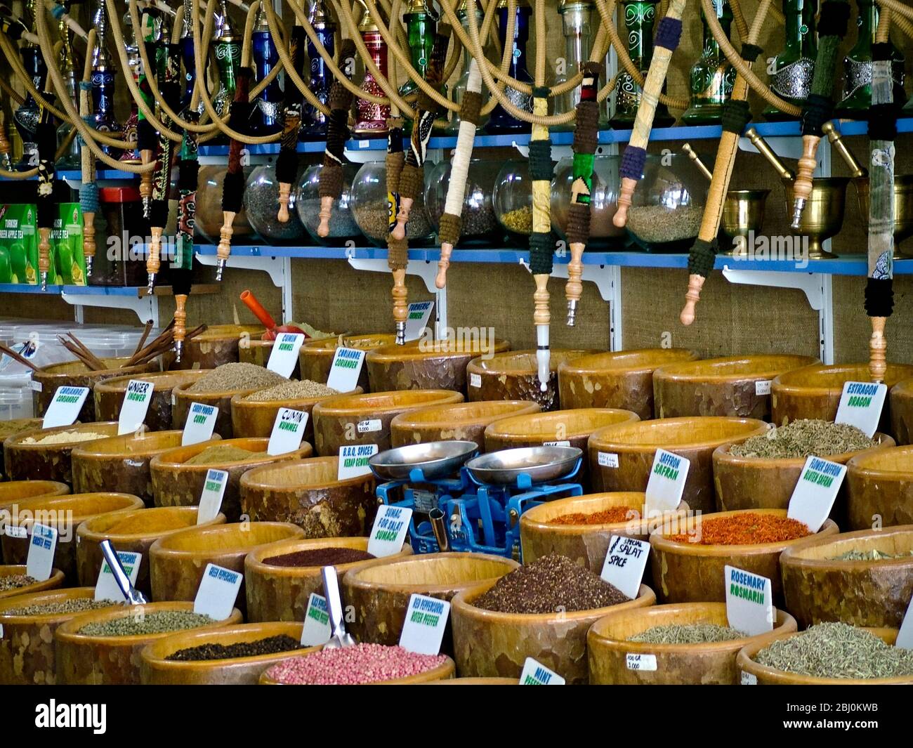 Bowls of spices and hookah pipes for sale in shop on waterfront at resort town of Dalyan, southern Turkey - Stock Photo