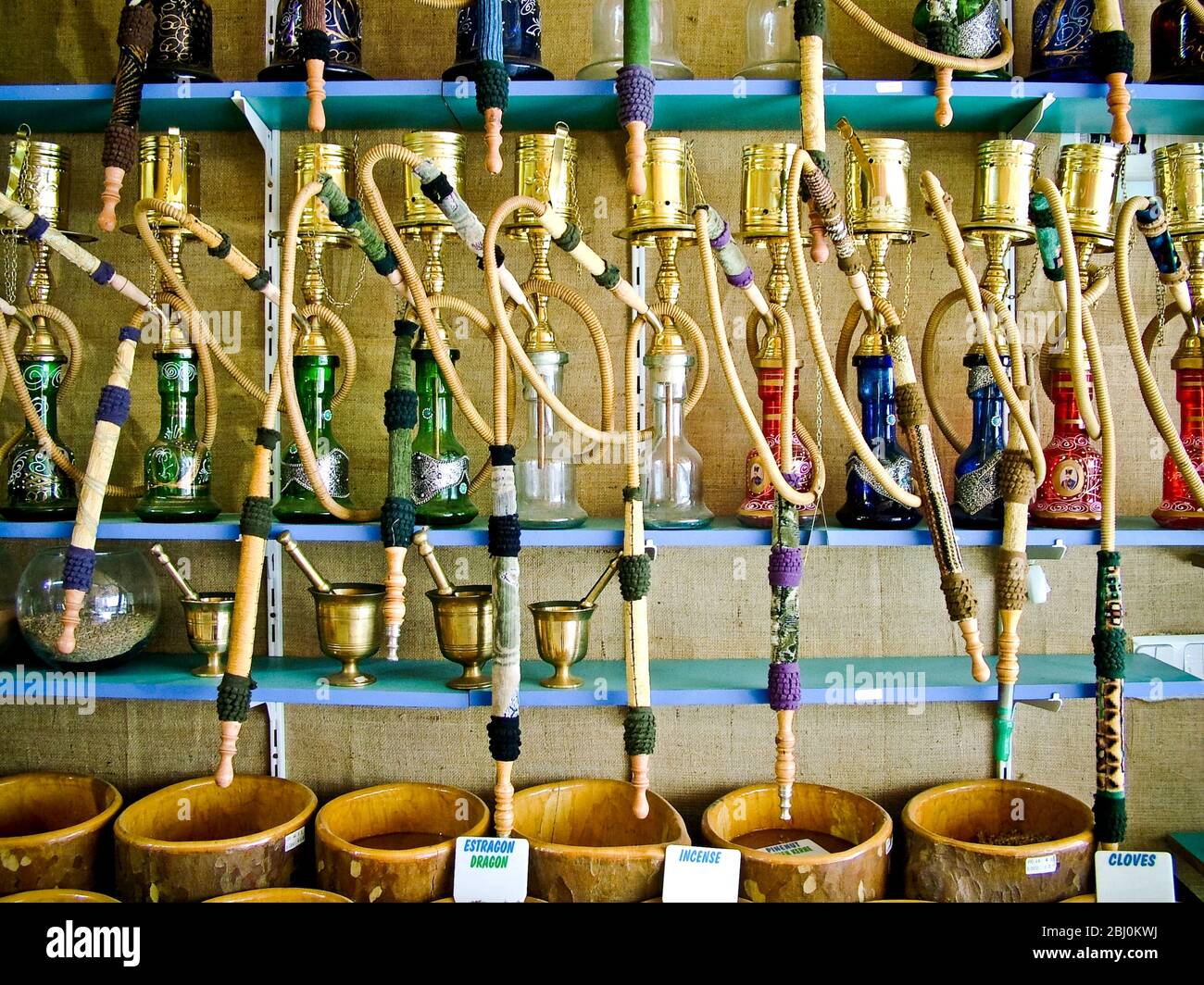 Bowls of spices and hookah pipes for sale in shop on waterfront at resort town of Dalyan, southern Turkey - Stock Photo