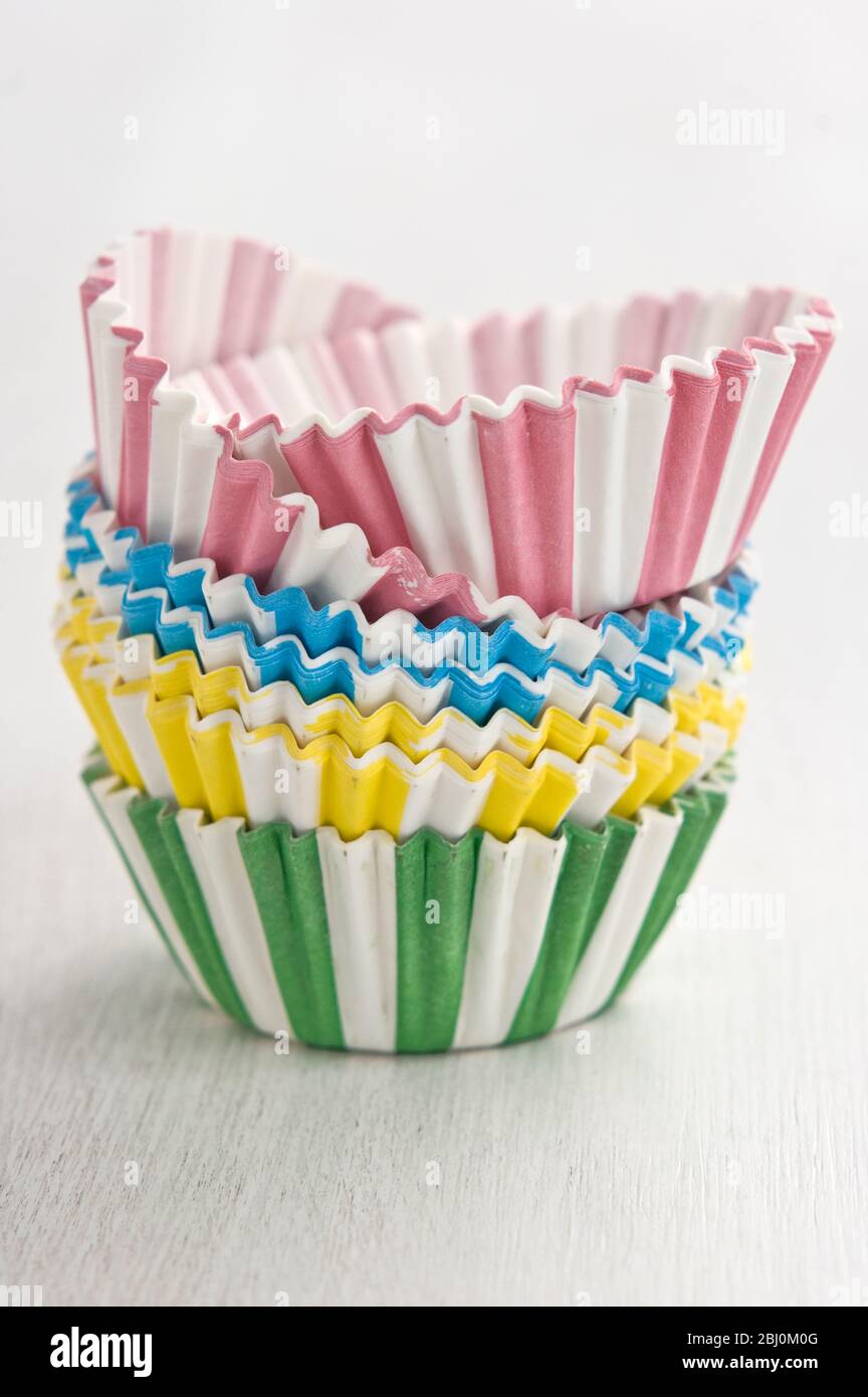 Stack of decorative striped paper cake and muffin cases - Stock Photo
