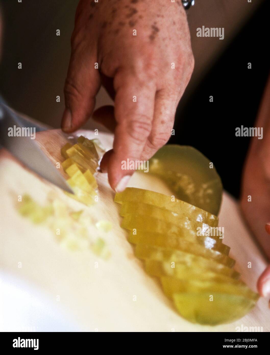 Italian chef and restaurateur, Antonion Carluccio slicing up Italian 'cedro' for a christmas dish - Stock Photo