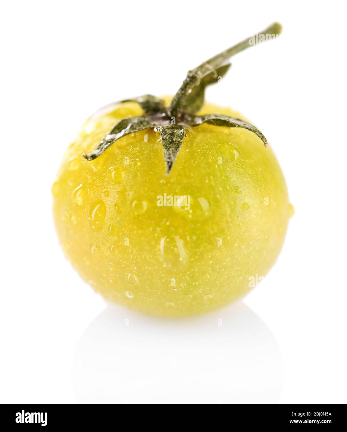 Green tomato with water drops isolated on white Stock Photo - Alamy