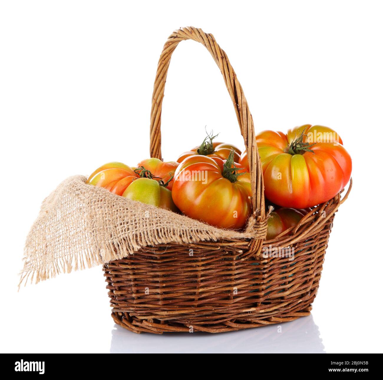 Green tomatoes in basket isolated on white Stock Photo - Alamy