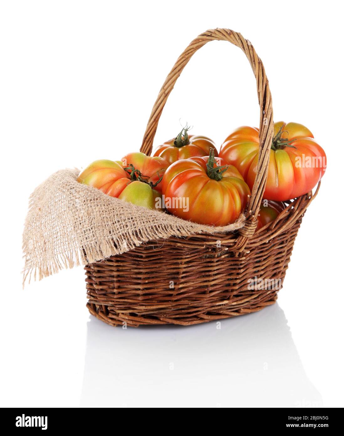 Green tomatoes in basket isolated on white Stock Photo - Alamy