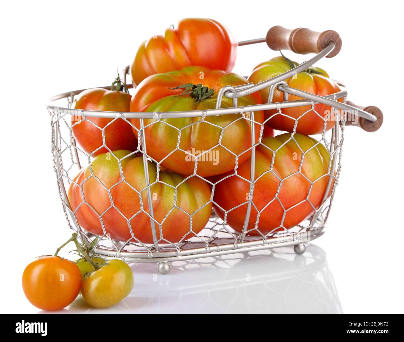 Green tomatoes in basket isolated on white Stock Photo - Alamy