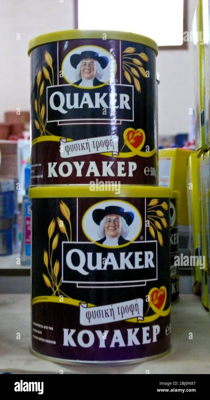 Packets of quick cook Quaker porage oats on shelf of supermarket in southern Cyprus, labelled in Greek - Stock Photo