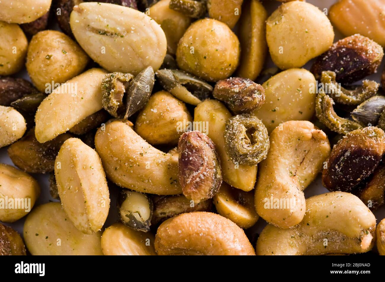 Mixed salted nuts and seeds - Stock Photo