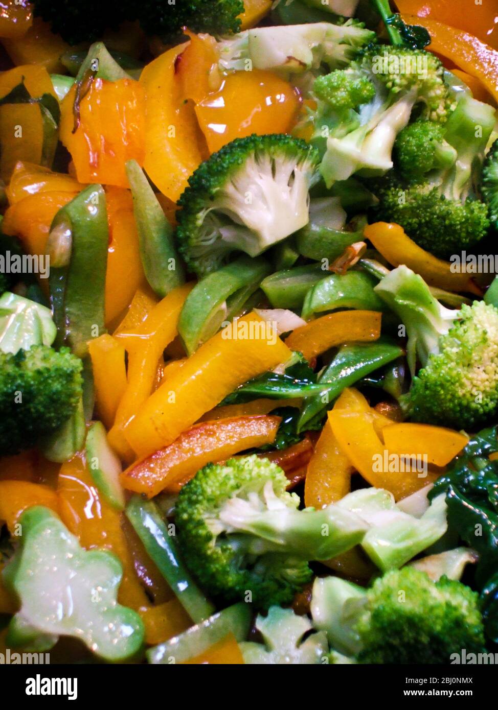 Quickly stir fried, mixed vegetables in the pan - Stock Photo