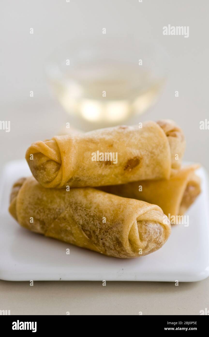 Small Thai spring rolls with sweet dipping sauce - Stock Photo