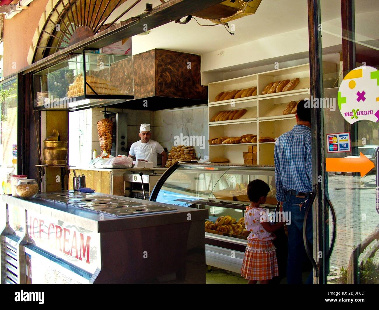 DÌ¦ner kebab and bread shop in Fethiye, Turkey with shopkeeper and customers - Stock Photo