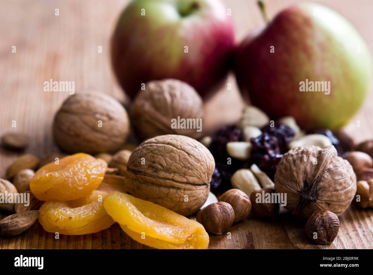 Selection of healthy snacks, on natural wooden surface - Stock Photo