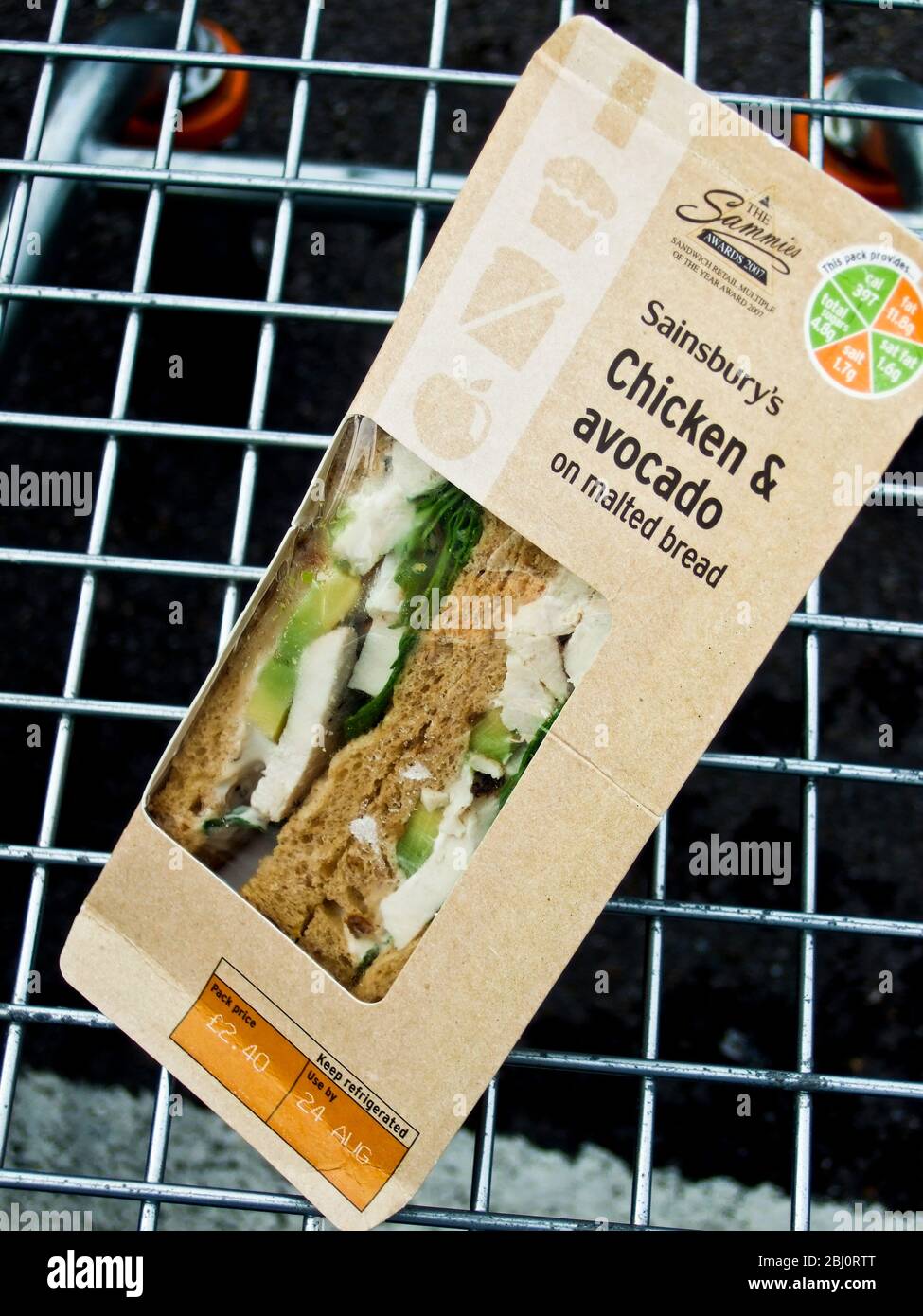 Packet of sandwiches bought in Sainsbury's in supermarket trolley - Stock Photo