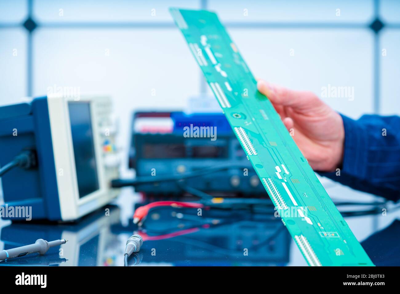 Debugging electronics device. PCB witch microcontroller in electronics ...