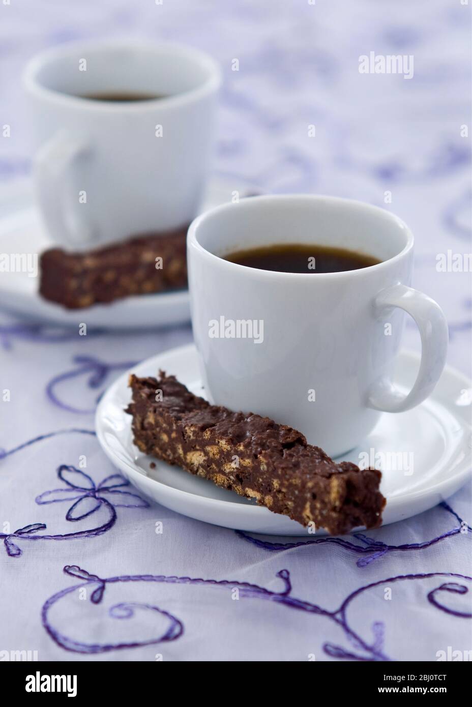 Chocolate refrigerator fingers with black coffee - Stock Photo