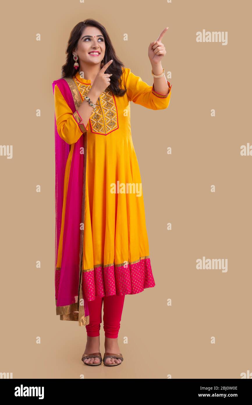 Young asian woman pointing up hi-res stock photography and images - Alamy