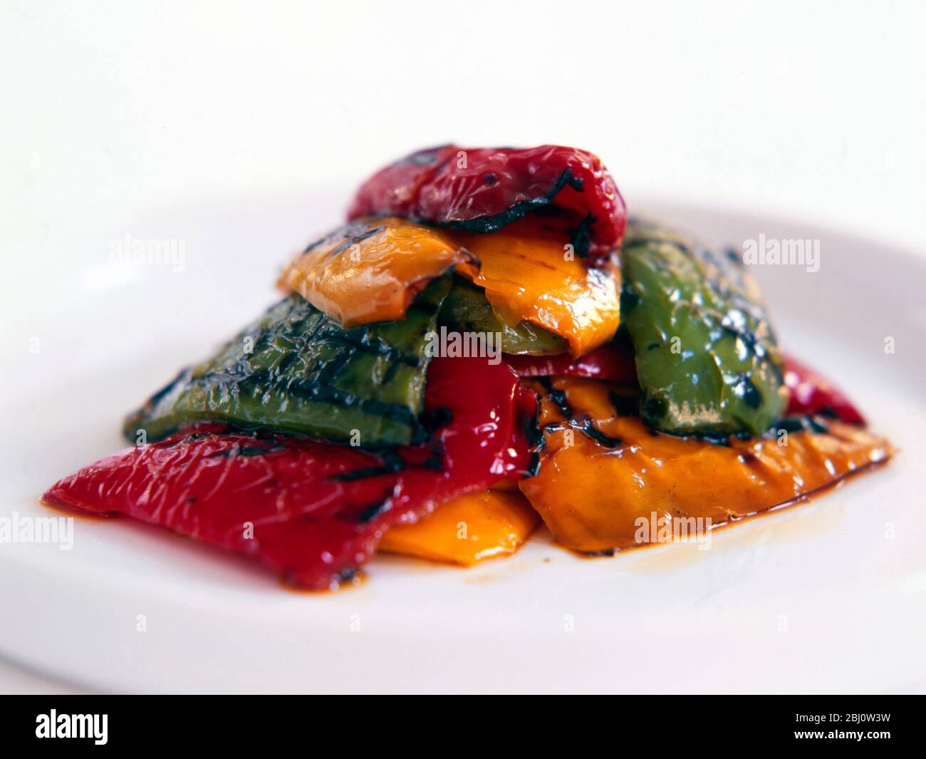 Pile of roast pepper pieces - Stock Photo