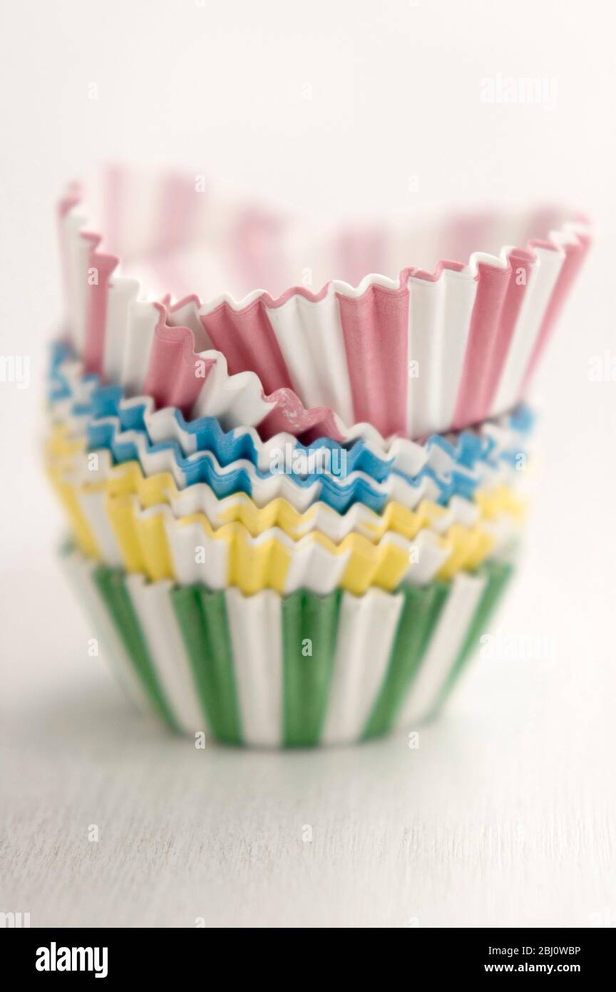 Stack of candy striped muffins cases - Stock Photo