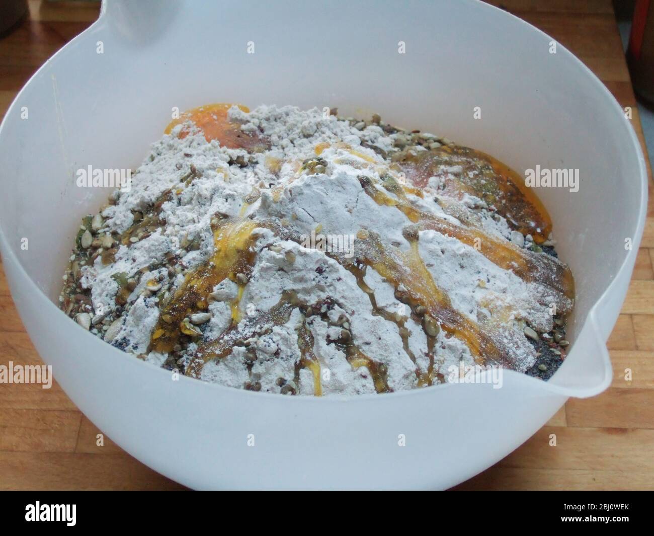 Making bread. Bowl with ingredients ready to mix. Wholemeal multigrain