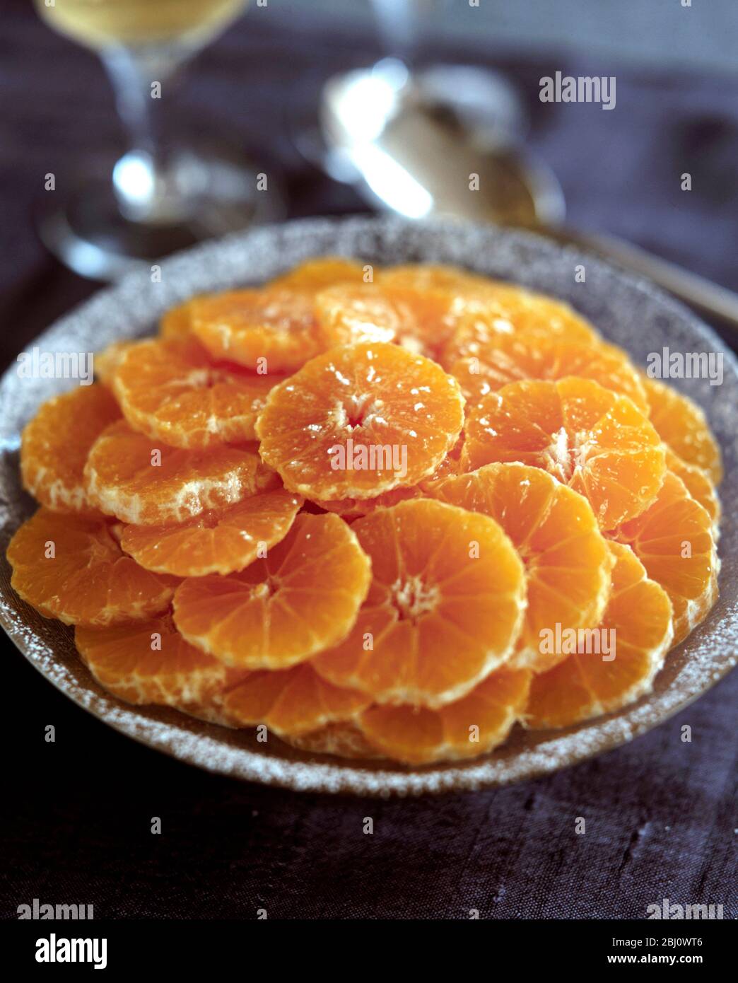 Dish of sliced oranges - Stock Photo