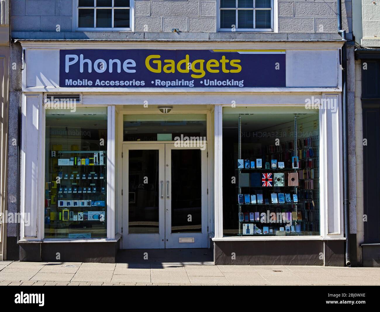 Shop front. Phone Gadgets, Mobile Accessories, Repairing, Unlocking. Stricklandgate, Kendal, Cumbria, England, United Kingdom, Europe. Stock Photo