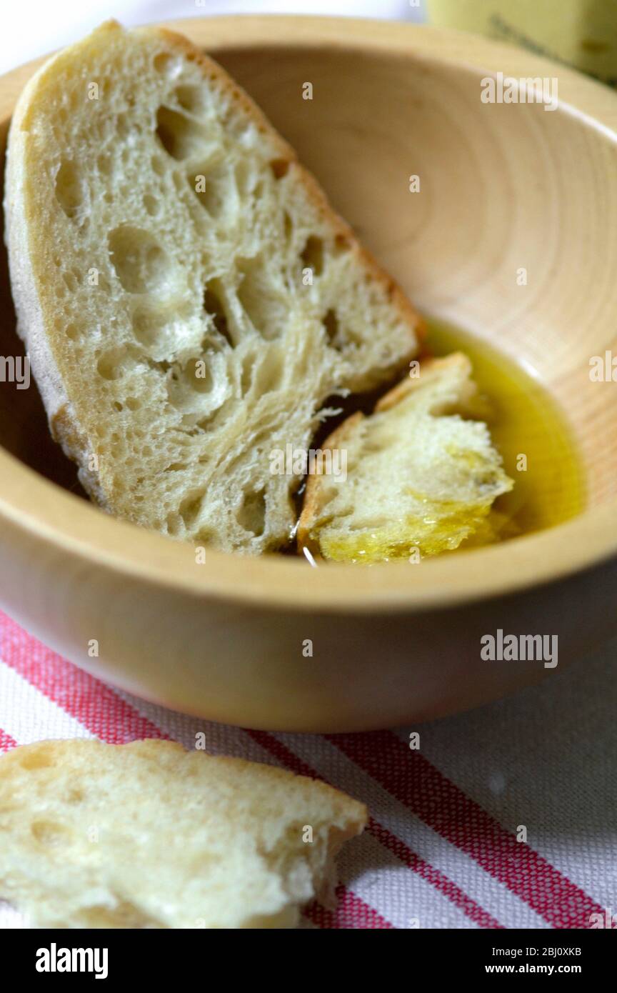 Extra virgin olive oil with rustic bread to dip in it Stock Photo Alamy