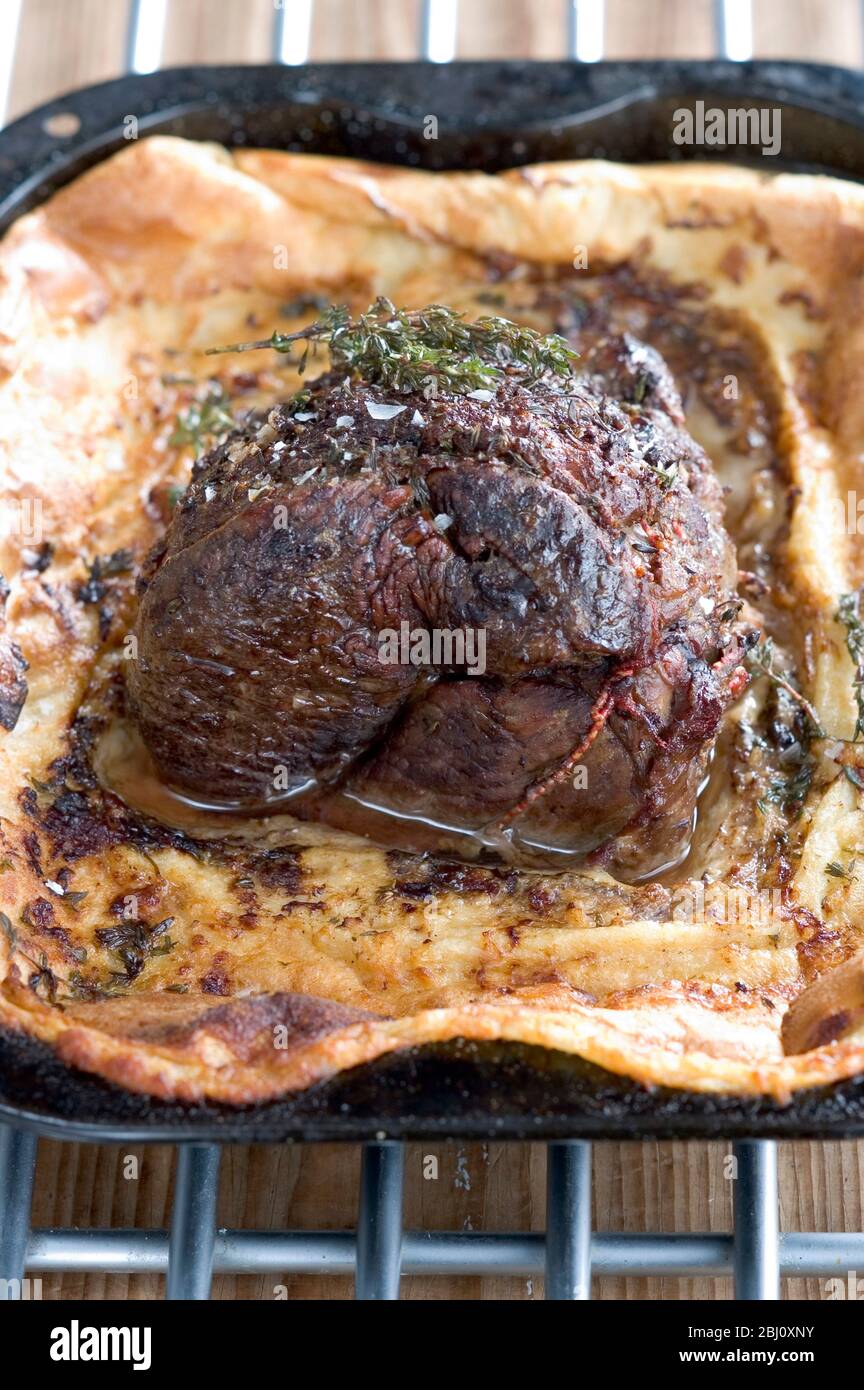 Beef traditionally roasted in batter pudding - Stock Photo