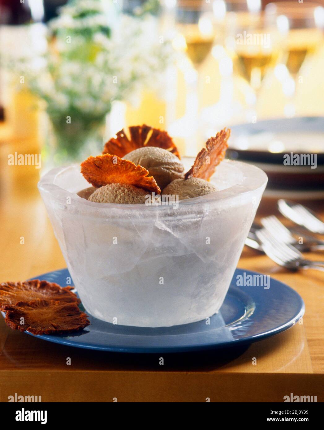 https://c8.alamy.com/comp/2BJ0Y39/ice-bowl-serving-ice-cream-with-pineapple-crisps-2BJ0Y39.jpg