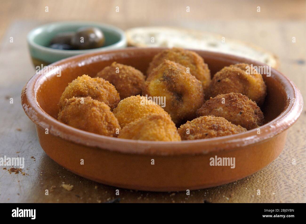 Italian mushrooms stuffed with ricotta chilli and garlic, coated with breadcrumbs and deep fried. - Stock Photo