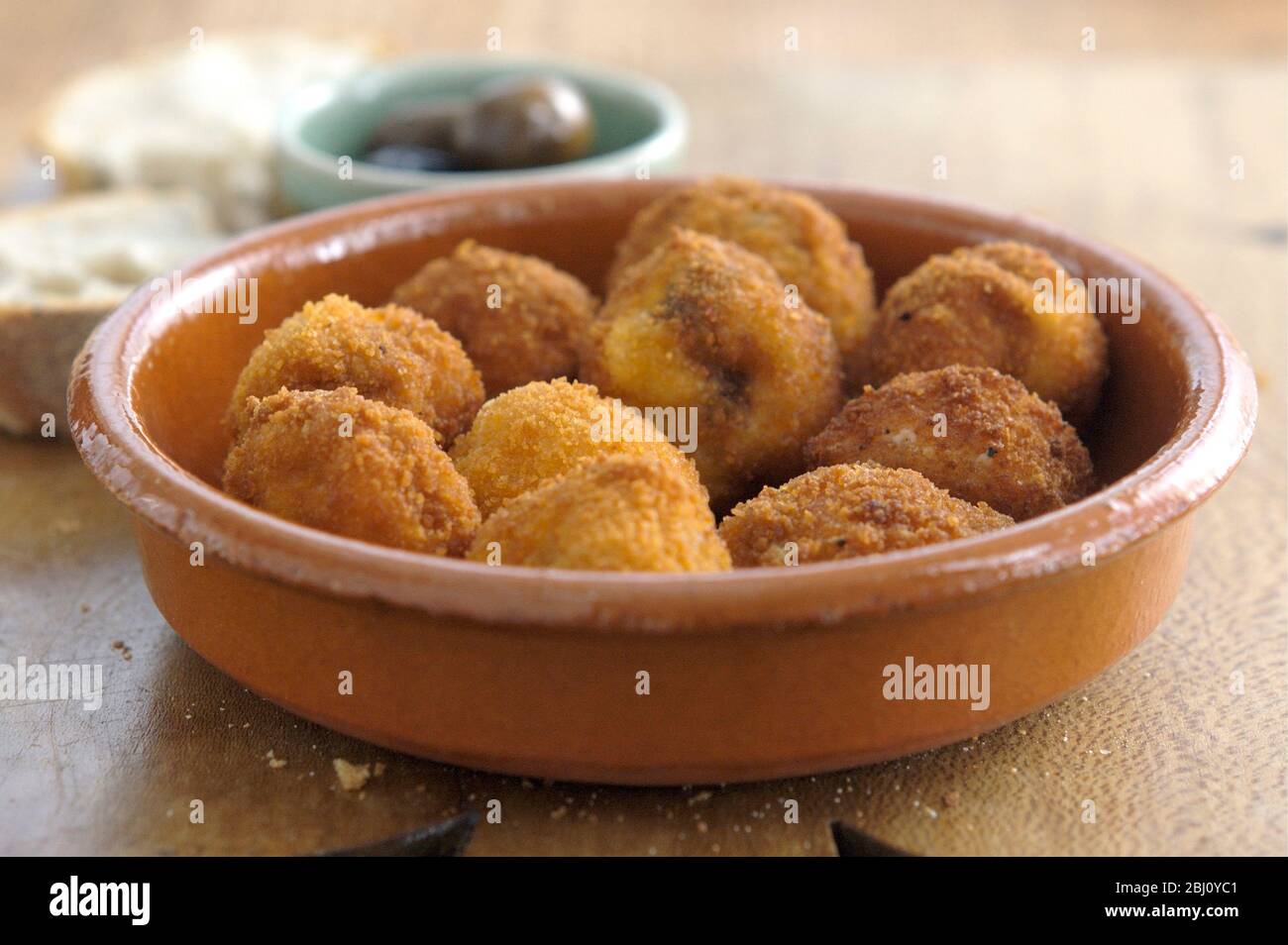Italian mushrooms stuffed with ricotta chilli and garlic, coated with breadcrumbs and deep fried. - Stock Photo