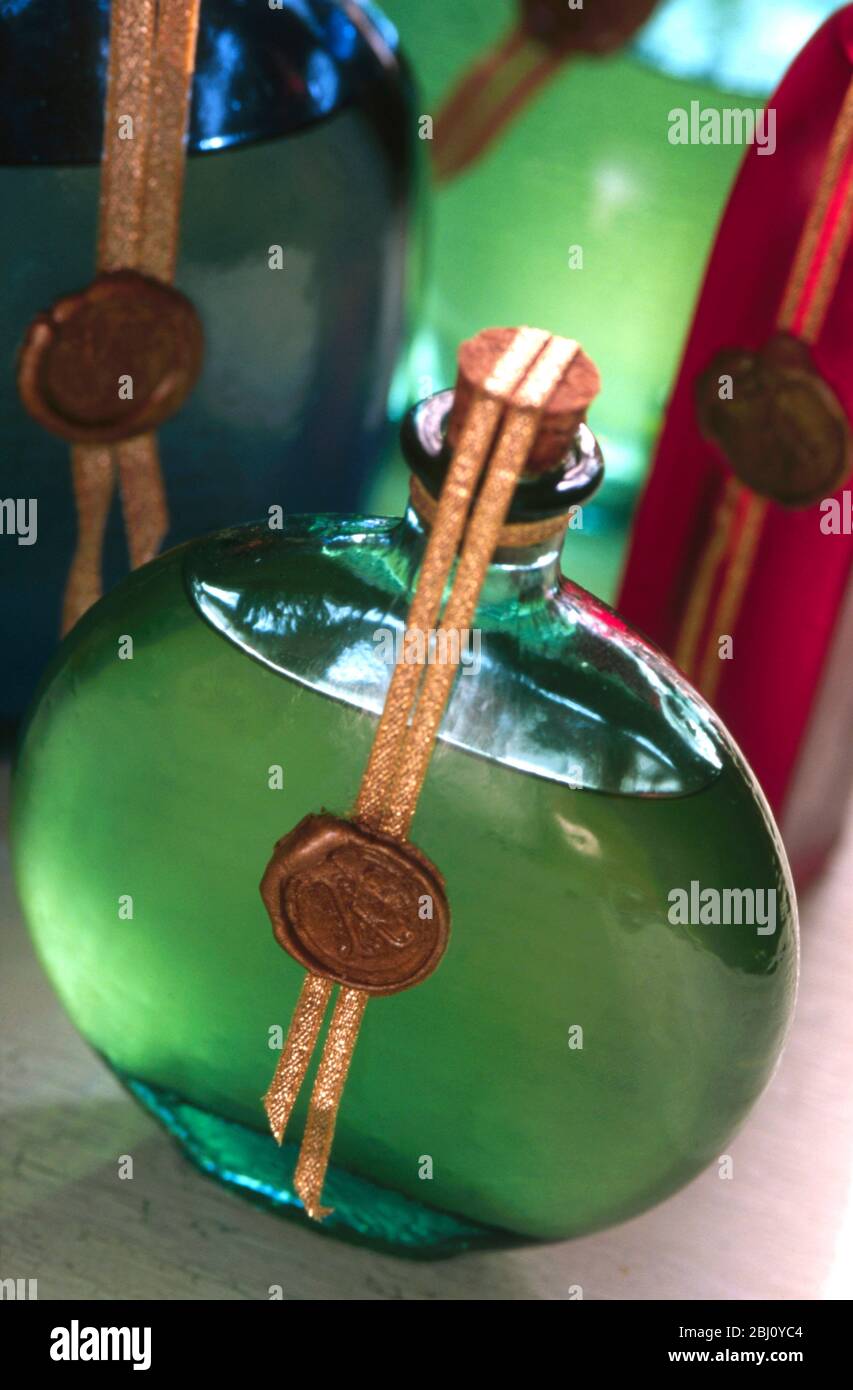 Multi coloured and multi shaped glass bottles - Stock Photo