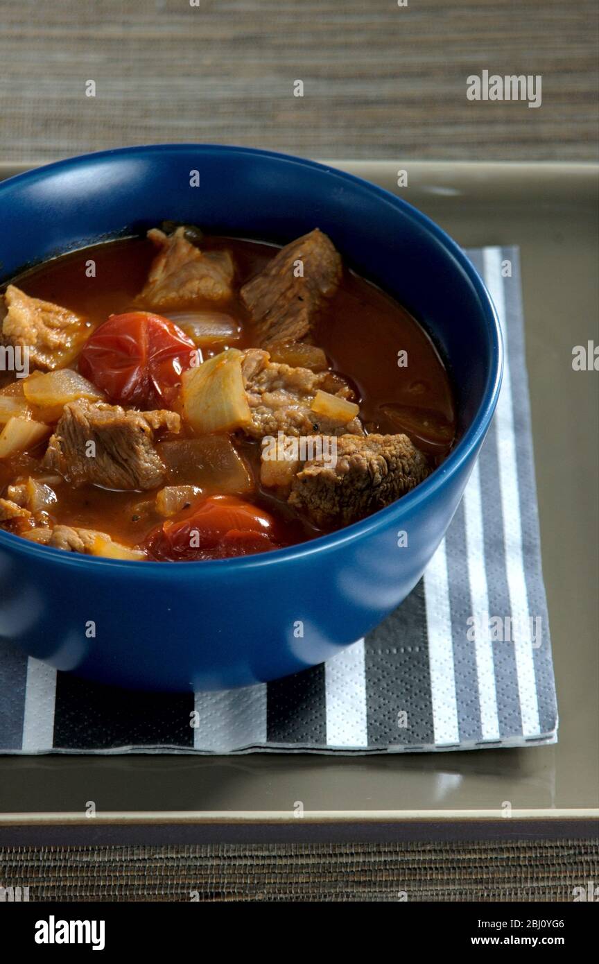 Spicy lamb and tomato casserole - Stock Photo