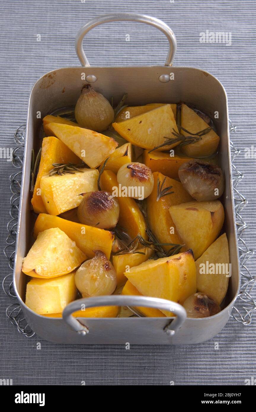 Roast root vegetables with olive oil and rosemary - Stock Photo