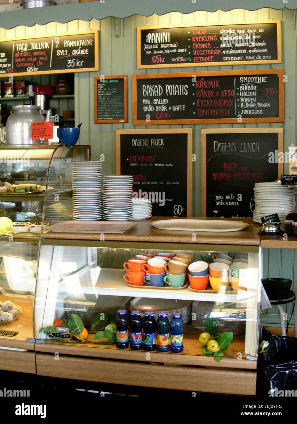 Interior showing menus and coffee on offer in Cafe Mignon in Varberg, Sweden - Stock Photo