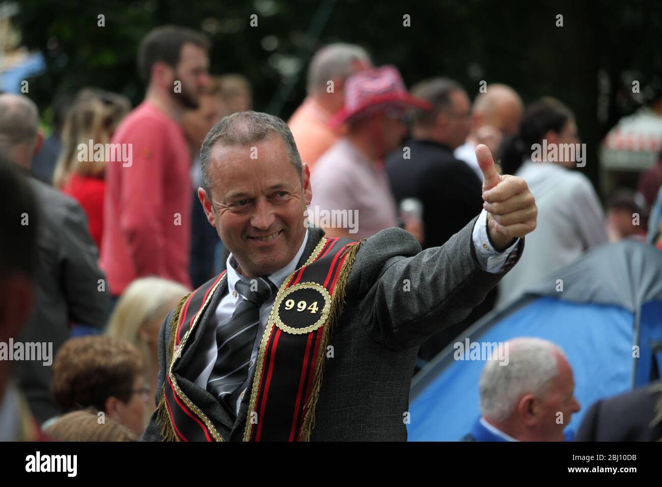 Thumbs up! This black man from RBP 994 gives the thumbs up to some friends. Stock Photo