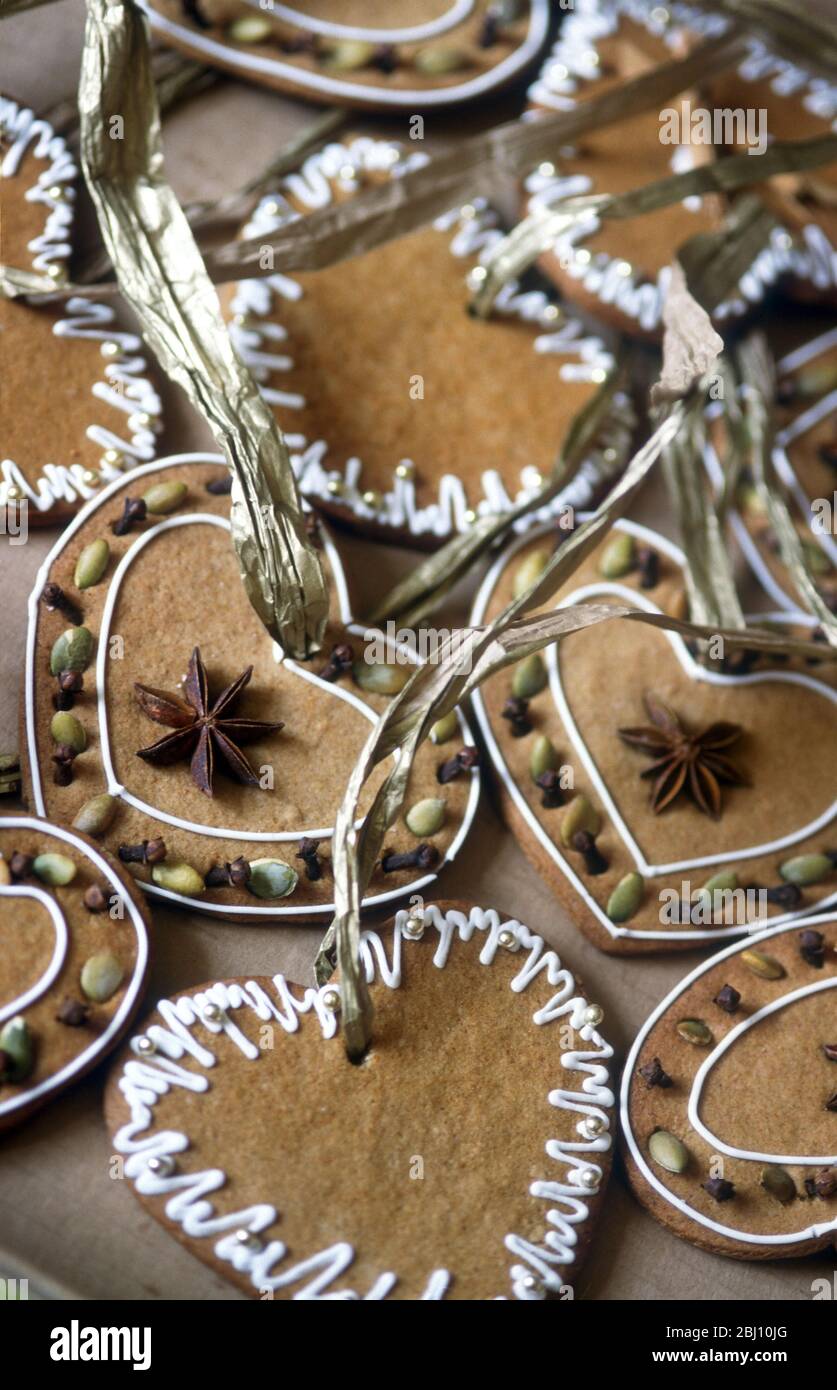 Swedish style ginger biscuits made to hang as christmas tree decorations - Stock Photo