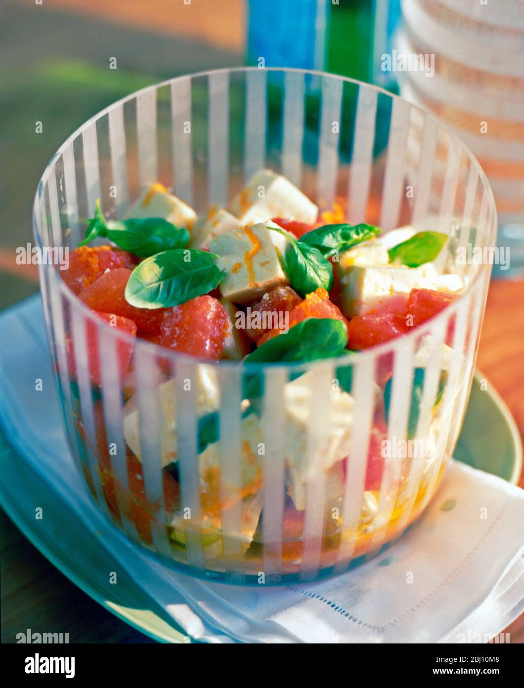 Red water melon feta basil and orange salad - Stock Photo