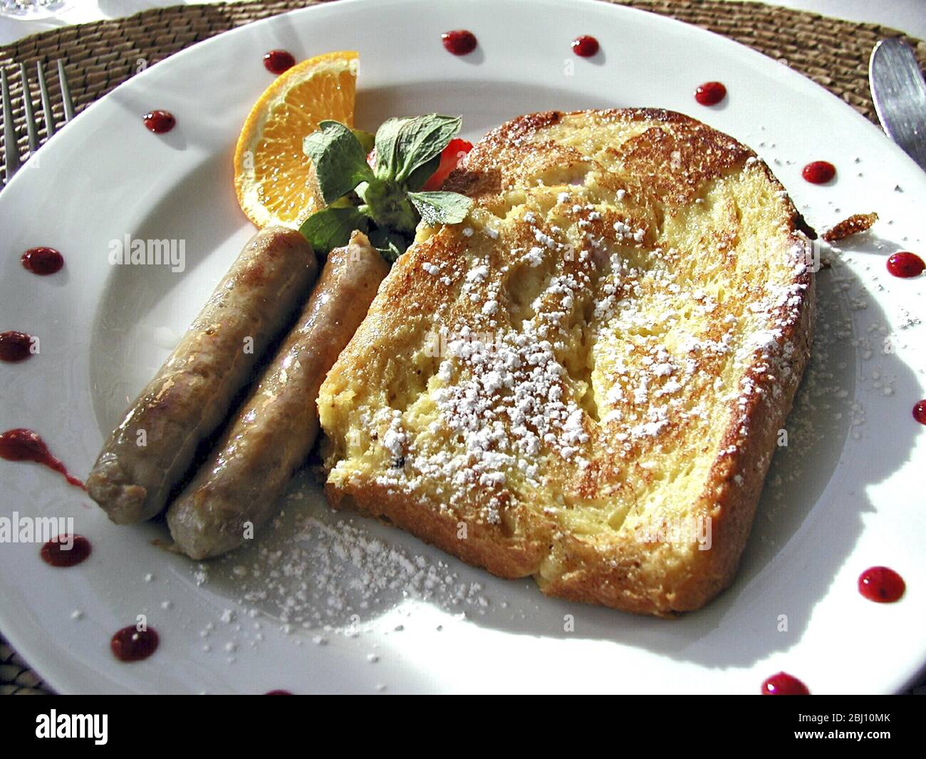 French toast and sausages with orange and watercress - breakfast in American country hotel. Vermont USA - Stock Photo